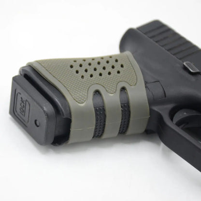 Universal rubber grip for handguns